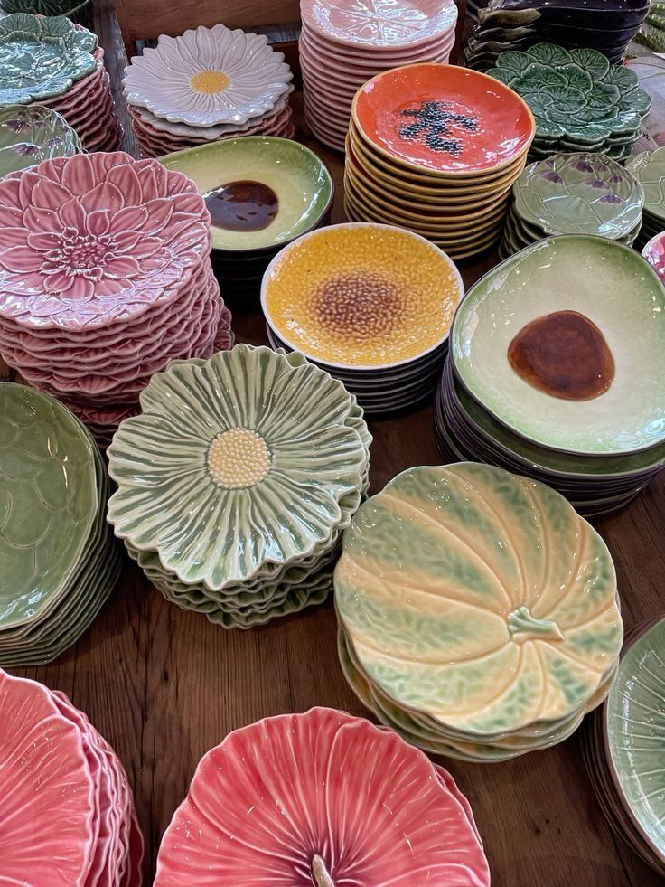 Layered pastel ceramic plates with floral and textured details